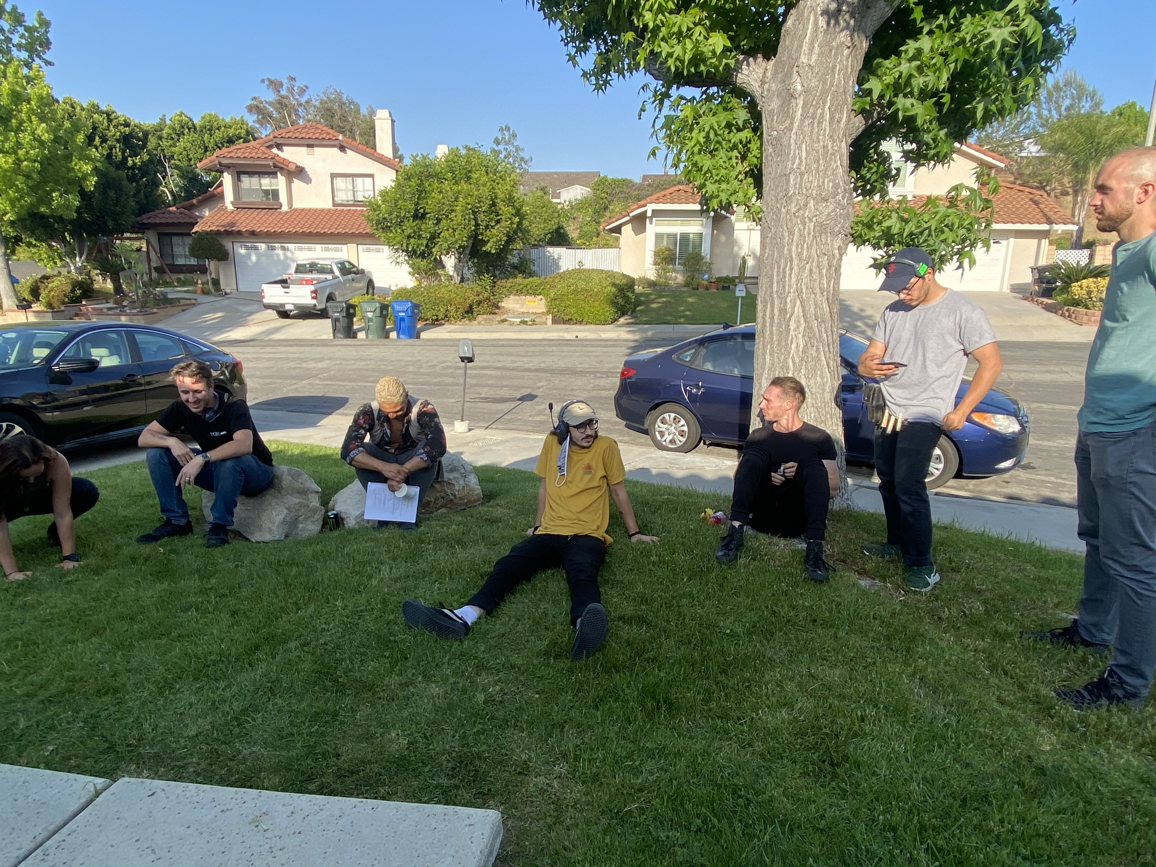 Some Fallen Drive team members lounge on the front lawn